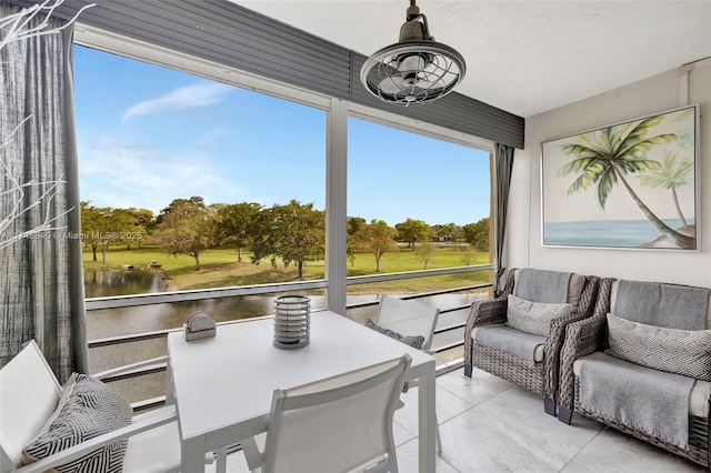 sunroom with a water view