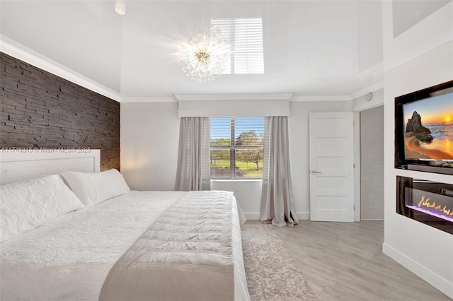 bedroom with baseboards and crown molding