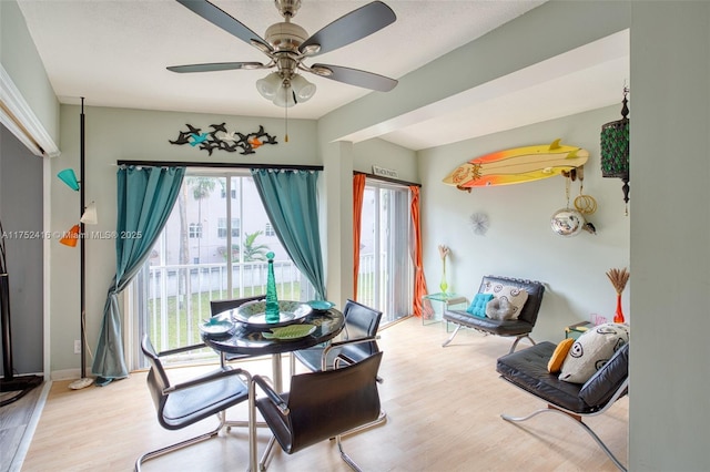 dining room featuring ceiling fan and light wood finished floors