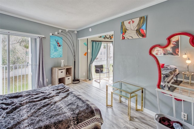 bedroom featuring access to outside, multiple windows, ornamental molding, and light wood-style flooring