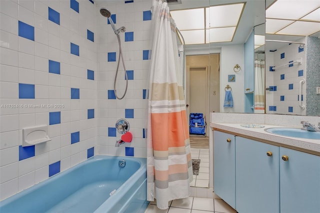 bathroom with shower / tub combo, tile patterned flooring, and vanity