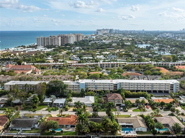 bird's eye view featuring a water view and a city view