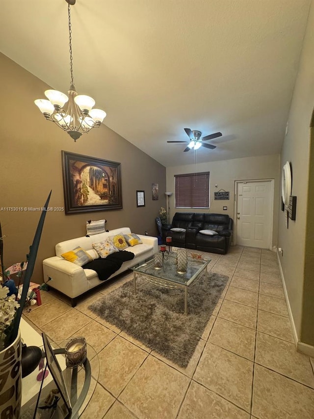 tiled living area featuring lofted ceiling, baseboards, and ceiling fan with notable chandelier