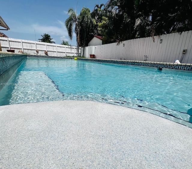 view of pool with a fenced backyard and a fenced in pool