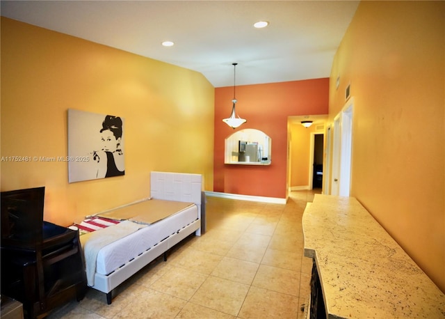 interior space with light tile patterned floors, baseboards, and recessed lighting