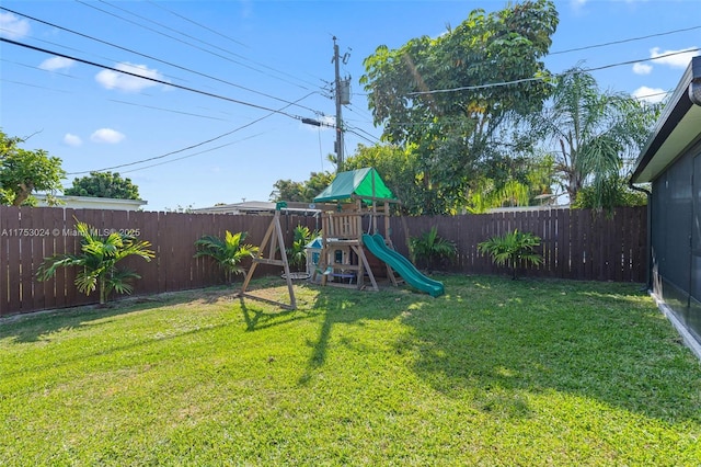 view of play area featuring a yard and a fenced backyard