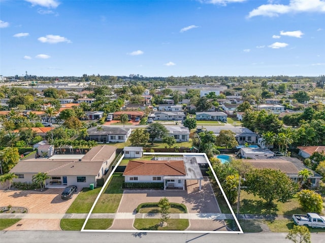 birds eye view of property with a residential view