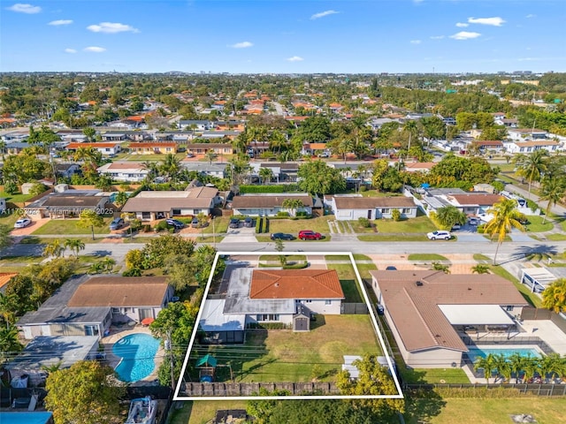 birds eye view of property with a residential view