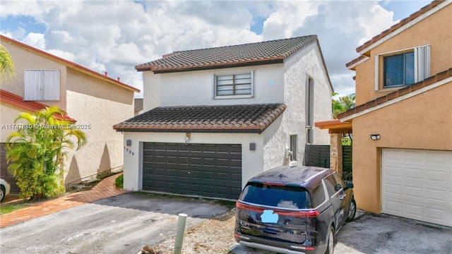 view of front of home with a tiled roof and stucco siding