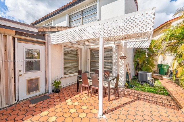 1089 SW 135th Pl, Miami, FL 33184 - view of patio / terrace with cooling unit, outdoor dining area, and a pergola