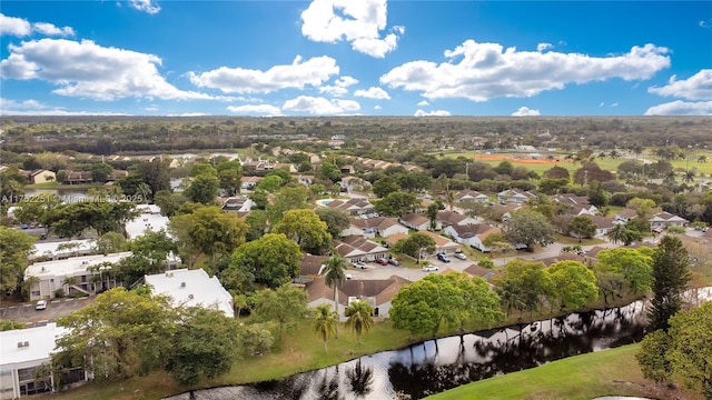 bird's eye view featuring a residential view and a water view