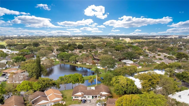 drone / aerial view with a water view and a residential view