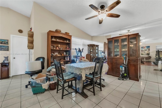 8601 Bridle Path Ct Unit 222, Davie, FL 33328 - dining room featuring vaulted ceiling, ceiling fan, light tile patterned floors, and a textured ceiling