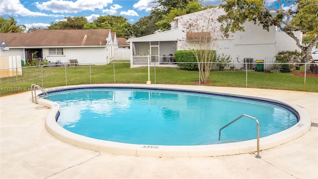 pool with a sunroom, central AC, a yard, and fence