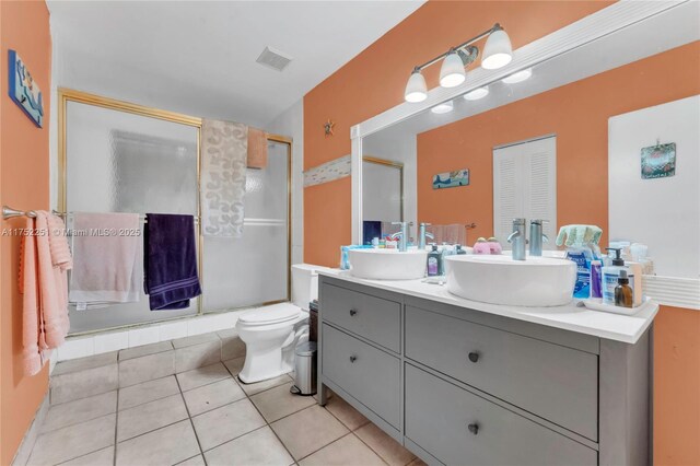 8601 Bridle Path Ct Unit 222, Davie, FL 33328 - bathroom with vanity, an enclosed shower, toilet, and tile patterned flooring