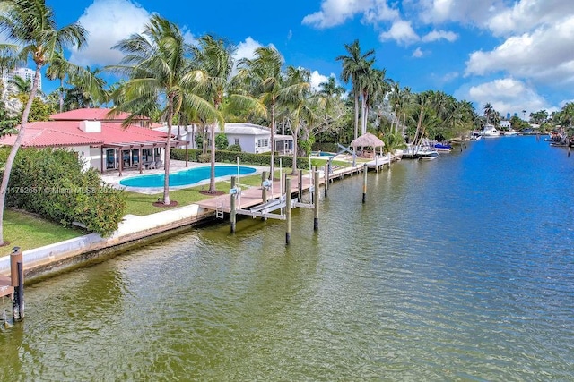 dock area with a water view and boat lift