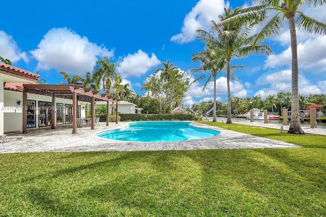 pool with a yard and a pergola