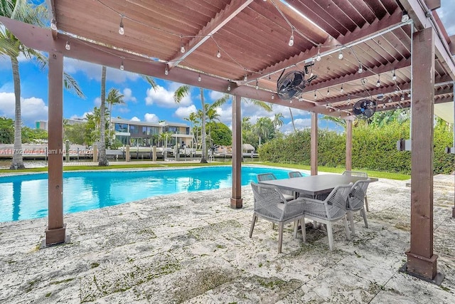 pool featuring outdoor dining area and a patio