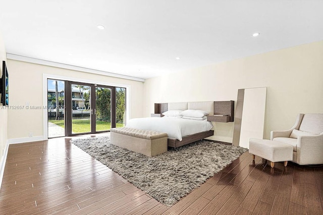 bedroom featuring access to outside, recessed lighting, wood-type flooring, and baseboards