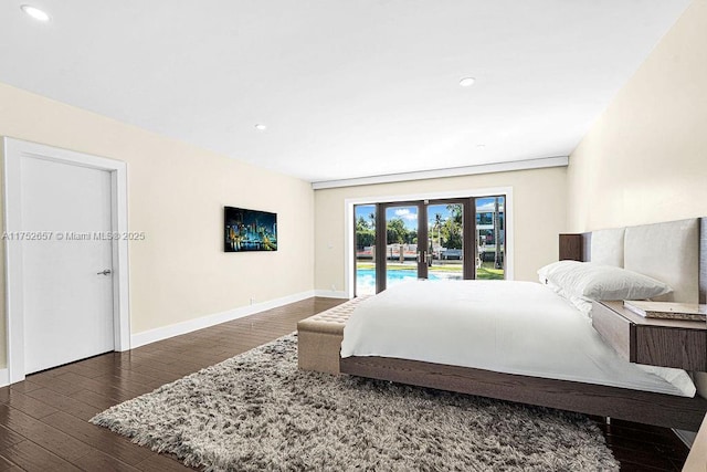 bedroom with recessed lighting, dark wood-type flooring, baseboards, access to outside, and french doors