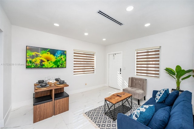 living area featuring marble finish floor, recessed lighting, visible vents, and baseboards