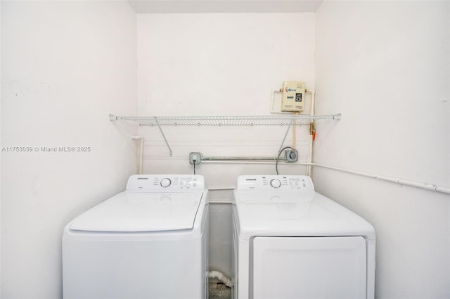 washroom featuring laundry area and separate washer and dryer