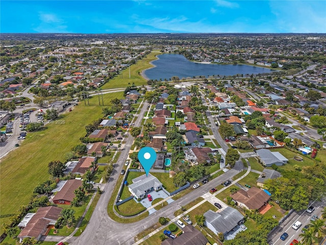 birds eye view of property featuring a residential view and a water view