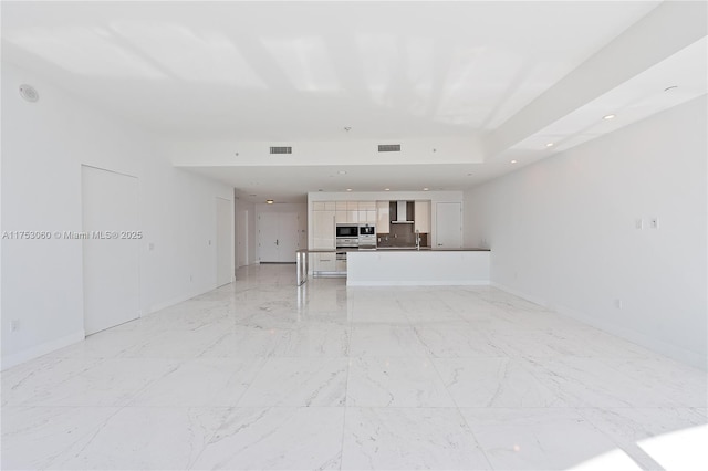 unfurnished living room featuring marble finish floor, baseboards, visible vents, and recessed lighting