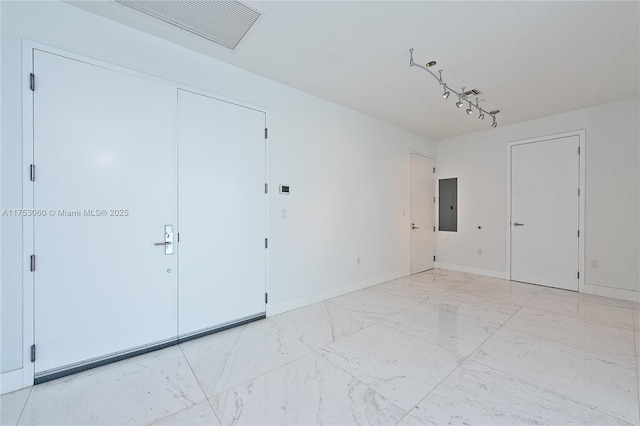 unfurnished bedroom featuring marble finish floor, electric panel, visible vents, and baseboards