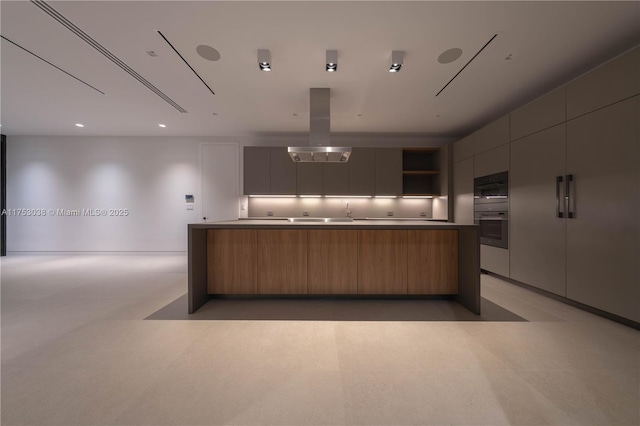 kitchen featuring light floors, open shelves, dark countertops, island range hood, and modern cabinets