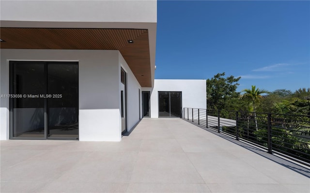 view of patio with a balcony