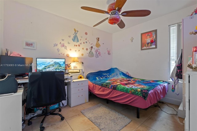 bedroom with a ceiling fan and light tile patterned flooring