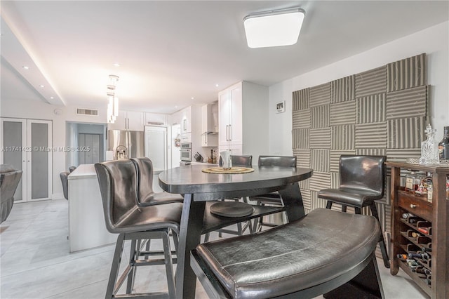 dining space featuring recessed lighting, visible vents, and light tile patterned floors