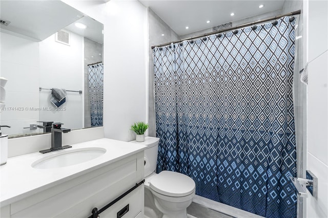 bathroom with toilet, recessed lighting, visible vents, and vanity