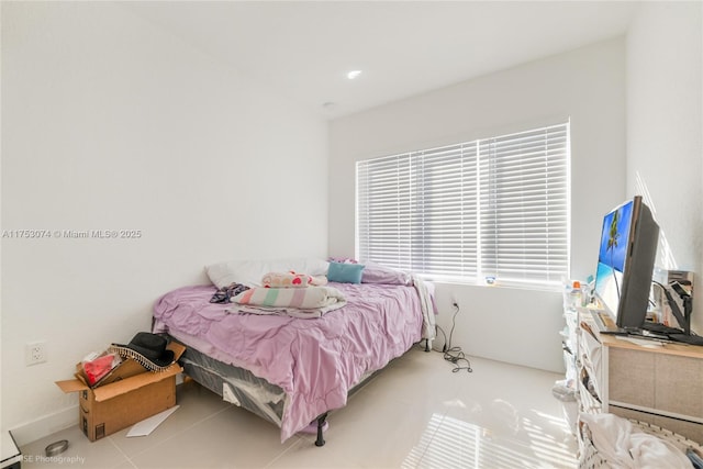 bedroom featuring light tile patterned floors