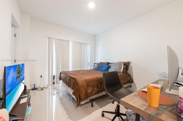 bedroom with light tile patterned floors