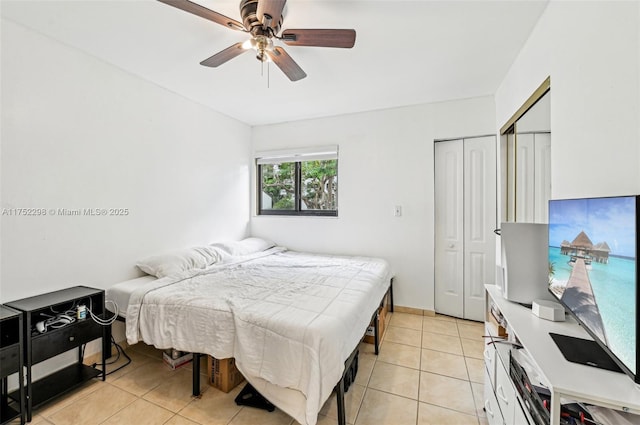 bedroom featuring light tile patterned floors and a ceiling fan