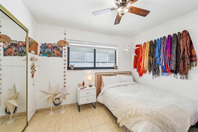 bedroom featuring light tile patterned flooring and ceiling fan