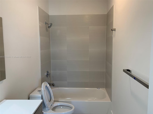 bathroom with toilet, tub / shower combination, and vanity