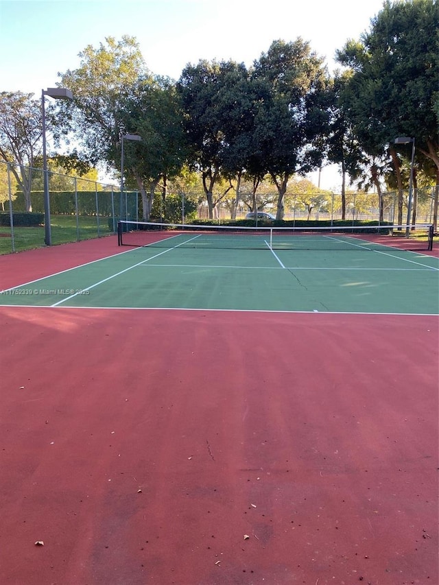 view of sport court with fence