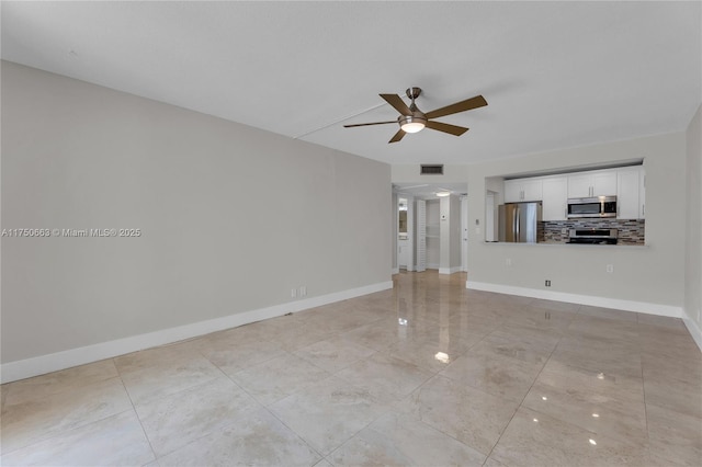 unfurnished living room featuring visible vents, ceiling fan, and baseboards