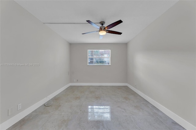 unfurnished room featuring ceiling fan and baseboards