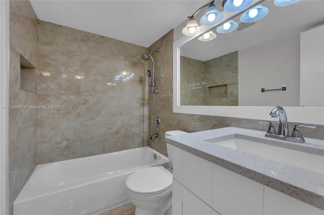 bathroom with visible vents, vanity, toilet, and bathing tub / shower combination