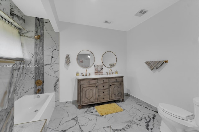 bathroom with double vanity, toilet, a bath, marble finish floor, and a sink