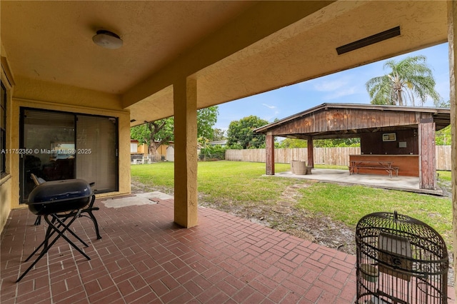 view of patio with fence and grilling area