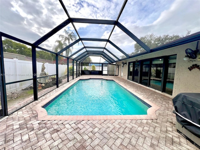 view of swimming pool with a fenced in pool, a patio area, a fenced backyard, and grilling area