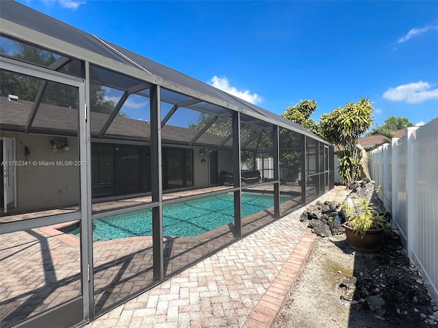 view of swimming pool featuring a fenced in pool, a patio area, a lanai, and a fenced backyard