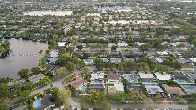 bird's eye view with a residential view and a water view