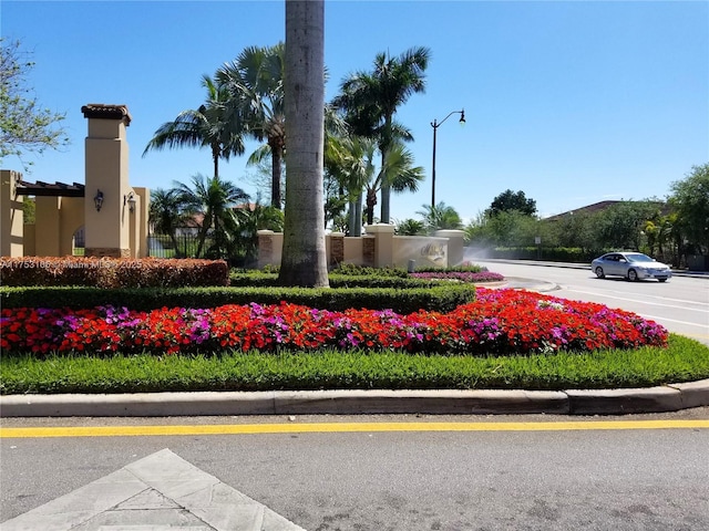 community sign with uncovered parking