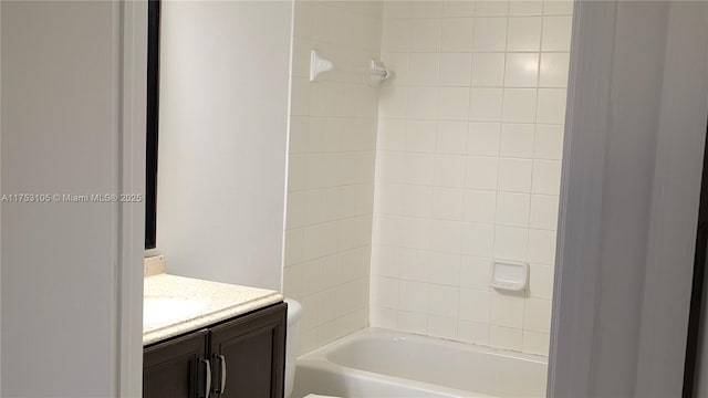 bathroom featuring toilet, bathtub / shower combination, and vanity